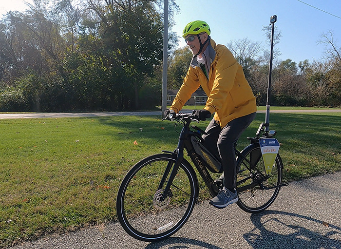 Dustin New rides the new “data bike” on a trail in South Bend, IN.
