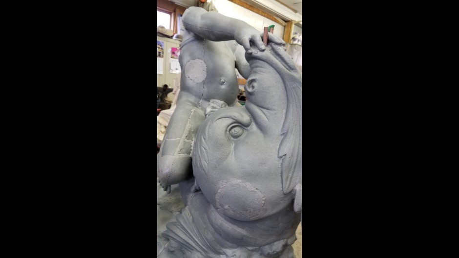 Various photos of the restoration of the fountain